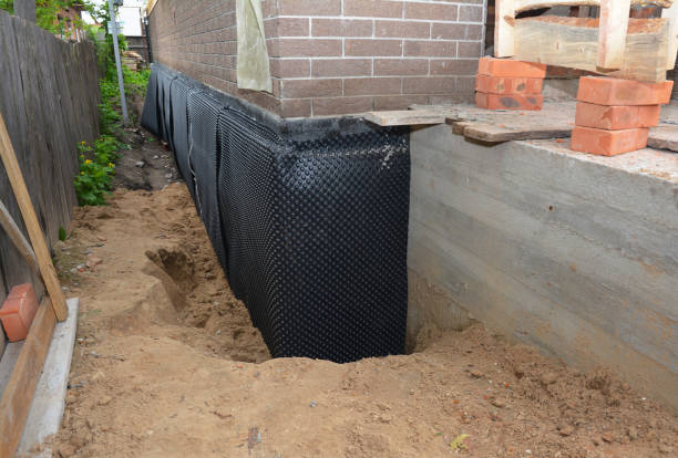 Happy homeowners after waterproofing job in Jellico